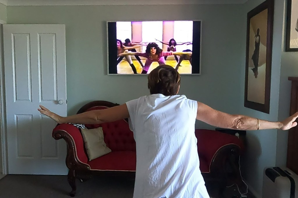 Woman exercising to Jane Fonda Workout