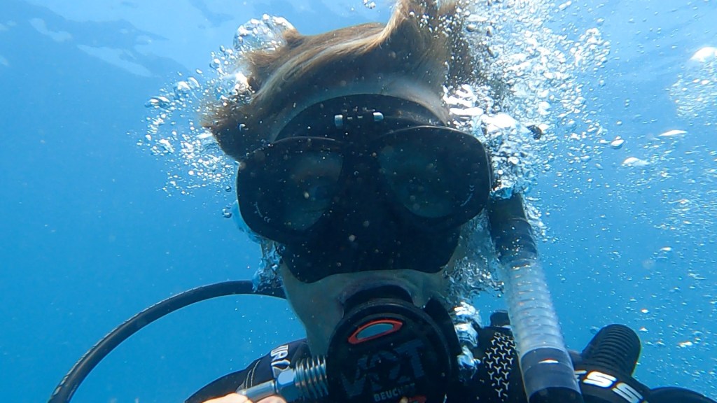 Woman diving close up of mask EMPTY NEST DIVER