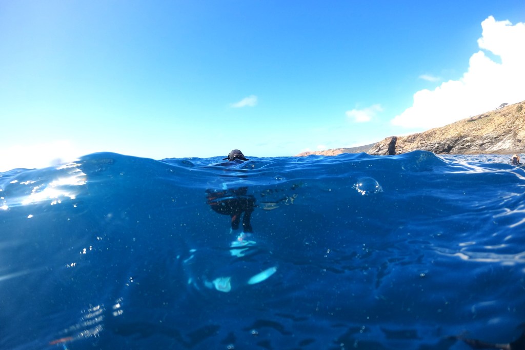 A Scuba Woman doing a buoyancy check