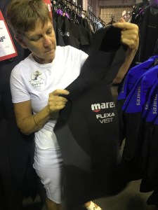 Woman looking at a diving vest
