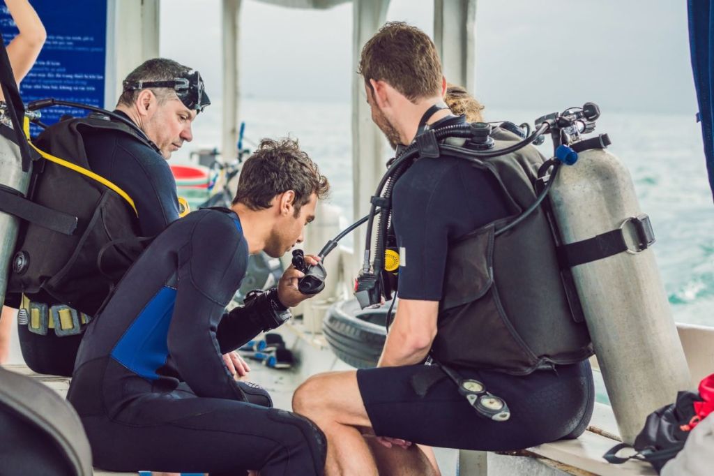 A group of scuba divers checking equipment
Empty Nest Diver